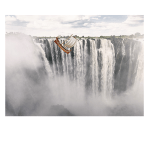 A digitally manipulated image of an ancient wooden sailing ship with white sails plunging over the edge of a massive waterfall. Mist rises from the cascading water, creating a surreal and dramatic scene that symbolises the perils of exploration and the unknown.